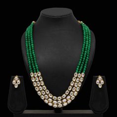 Enhance your outfits with our dignified Ruhi kundan necklace set made with kundan, green beads, and gold plating. This necklace and earrings jewelry set has sophisticated appeal that's perfect for all occasions. Specifications Materials used: kundan, green beads, gold plating Length: 46 cm (necklace), 2.5 cm (earrings) Weight: 120 grams Sold Out! At Romikas, we pride ourselves on the craftsmanship and high quality of our jewelry, designed to enhance your natural beauty. Please contact us with an Green Kundan Beaded Necklace Gift, Green Temple Jewelry Mala For Festive Occasions, Green Kundan Necklace With Round Beads, Green Kundan Beaded Necklaces For Diwali, Green Kundan Necklace With Cutdana For Diwali, Green Kundan Beads For Gift, Green Kundan Cutdana Necklace For Diwali, Festive Green Kundan Mala, Green Cutdana Jewelry Sets For Diwali