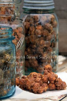 several jars filled with food sitting on top of a table