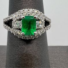 18k White Gold Diamond & Emerald Ring. 1.77 Carats. 5.8 Grams. Size 6.5. Pt3595 Luxury Gia Certified Emerald Ring In Sterling Silver, Luxury Gia Certified Sterling Silver Emerald Ring, White Gold Cluster Emerald Ring, Fine Jewelry, Dazzling Emerald Ring In White Gold And Platinum, Exquisite White Gold Emerald Ring Vvs Clarity, Exquisite White Gold Emerald Ring With Vvs Clarity, Gia Certified Emerald White Gold Ring, Gia Certified White Gold Emerald Ring, Diamond Emerald Ring