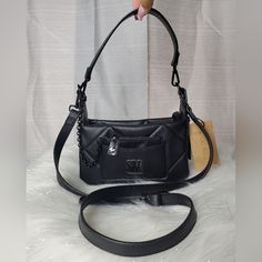 -Black Quilted Bag With "Sm" Logo Charm On The Front And Has Chainlink Cardholder In The Front Pocket -Comes With One Adjustable Crossbody Strap And One Shoulder Strap. Both Are Detachable -Inside Has One Zippered Wall Pocket -New With Tags. No Damages Dimensions: W:8" H:4¾" D:2¾ Night Out Shoulder Bag With Zipper Closure, Black Crossbody Shoulder Bag With Chain Strap, Evening Black Shoulder Bag With Zipper Closure, Black Bag With Chain Strap For On-the-go, Black Bags With Chain Strap, Crossbody Shoulder Bag With Removable Pouch For Night Out, Sm Logo, Black Quilted Bag, Fanny Pack Purse