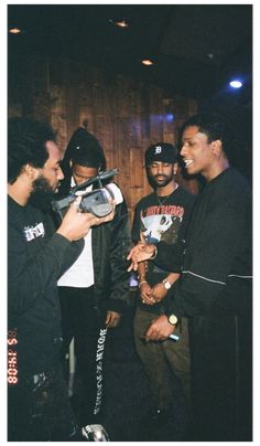 a group of young men standing next to each other