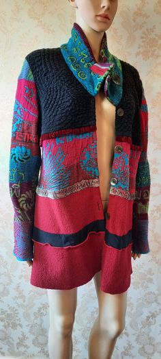 "Vintage multi coloured jacket made of various fabrics.  Five buttons to close, knitted sleeves, middle panel and collar, the black  top section is stretchy and the bottom section is wool. It has velvet ribbons as trimming. Bust;  42\" Length;  33\" Inside arm;  19\"      Made by Oliver Philips" Bohemian Patchwork Sweater Coat For Winter, Bohemian Winter Cardigan With Buttons, Bohemian Multicolor Wool Outerwear, Bohemian Multicolor Outerwear With Buttons, Multicolor Bohemian Outerwear With Buttons, Knitted Sleeves, Boho Coat, Boho Jacket, Knit Sleeve