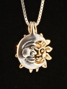 "This unique two part Eclipse Pendant is one of Marty's most popular. The Moon gently embraces its companion the Sun. The Sun and the Moon Charms are designed to nestle together, but can each be worn separately if desired. The combined pendant is 3/4\" high. It is pictured configured with a Bronze Sun and a Sterling Silver Moon. The contrasting colors of the two metals is especially appropriate for this design. Indulge in a piece of the heavens! An 18 inch sterling silver box chain is included i Silver Jewelry With Sun And Moon Design, Celestial Sun And Moon Design Jewelry, Spiritual Moon Jewelry With Sun And Moon Design, Symbolic Half Moon Jewelry With Moon Charm, Spiritual Metal Jewelry With Sun And Moon Design, Spiritual Sun And Moon Metal Jewelry, Silver Amulet Jewelry With Sun And Moon Design, Necklace Moon, Sun And Moon Necklace