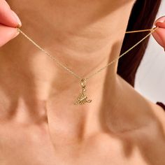 Elevate your elegance with our Scorpion Necklace, a striking piece designed for the bold and sophisticated woman. Perfect for adding a touch of fierce glamour to any outfit, this necklace is a must-have accessory for those who dare to stand out. - Made in 14k Solid Gold - Pendant: 11.90x8.45 mm / 0.47x0.33 inches- Thickness: 2.20mm / 0.09 inches -This product comes with iconic Norm Jewels gift box Elegant Long Chain Charm Necklace, Elegant Long Clavicle Chain Charm Necklace, Formal Pendant Charm Necklace, Gold Plated Charm Necklace For Party, Chic Clavicle Chain Necklace Gift, Luxury Pendant Chain Necklace With Charms, Elegant Metal Charm Necklace With Adjustable Chain, Elegant Pendant Charm Necklace With Clavicle Chain, Elegant Pendant Charm Necklace With Chain