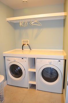 a washer and dryer in a small room