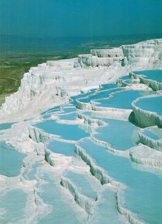 an aerial view of the white cliffs and blue water in yellowstone national park, wyoming