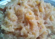 a white plate topped with rice on top of a table