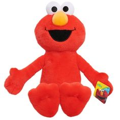 a red stuffed animal with big eyes and an orange beak on it's face