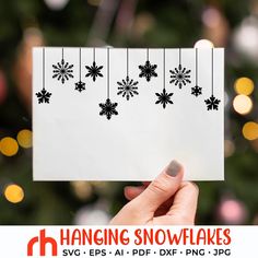 someone holding up a card with snowflakes on it