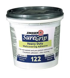 a bucket of suregrip heavy duty wall covering adhesivee, 12oz