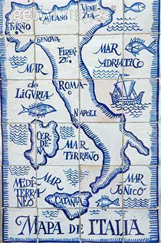 a blue and white tile with the map of italy