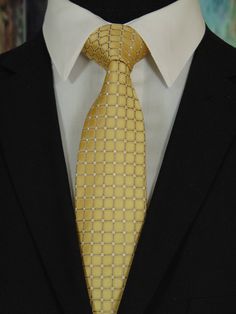 "Men's 100% silk gold necktie is the perfect tie for the big wedding day or everyday. This gold tie available as a extra long Neck Tie. Handmade from 100% silk, this special collection features a .75\" Eds Neckties logo at the bottom right front corner of every tie and a larger logo located on the tipping (Back of the tie). The label features the collection name (Nathaniel Alexandria) Named after my son Nathaniel and my daughter Alexandria. Expertly hand-made from 100% silk you can select your l Fitted Gold Tie For Semi-formal Occasions, Classic Gold Tie For Formal Occasions, Classic Gold Suit And Tie Accessories For Black Tie, Classic Fitted Gold Ties, Elegant Gold Ties For Business, Classic Gold Tie And Suit Accessories, Classic Gold Suit And Tie Accessories For Formal Events, Classic Gold Suit And Tie Accessories For Formal Occasions, Elegant Yellow Tie For Formal Occasions