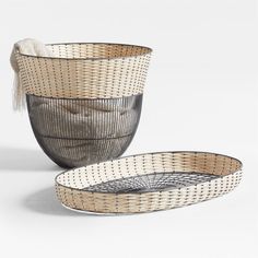 two woven baskets sitting next to each other