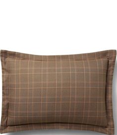 a brown and black plaid pillow on a white background with the words,'bedding is