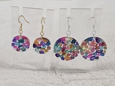 These handmade resin earrings are filled with multicolour sea shell stones. They are light and colourful. There are 2 sizes, 2cms and 3cms. You can also choose between gold and silver earring hooks. They are hypoallergenic and safe for sensitive ears. Colorful Round Earrings Gift, Multicolor Resin Round Jewelry, Colorful Round Earrings For Gift, Multicolor Round Resin Jewelry, Hypoallergenic Rainbow Round Earrings, Handmade Rainbow Round Earrings, Handmade Round Rainbow Earrings, Handmade Multicolor Resin Jewelry, Handmade Rainbow Resin Jewelry