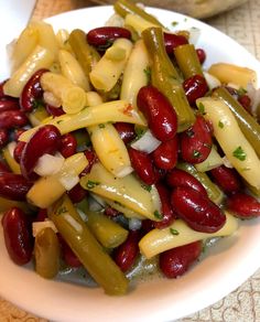 a white plate topped with beans and cheese