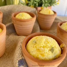 several clay pots filled with food on top of a table