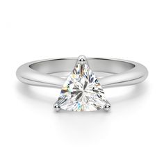 a white gold engagement ring with a pear shaped diamond