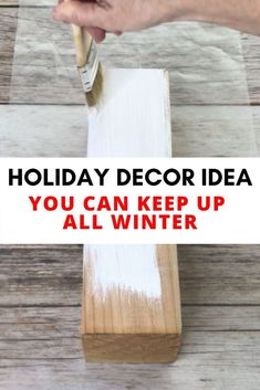 a person is painting a wooden box with white paint and the words holiday decor idea you can keep up all winter