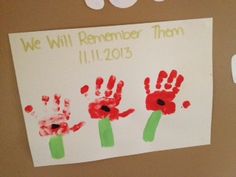 a bulletin board with handprints on it that says we will remember them 11 11 2013