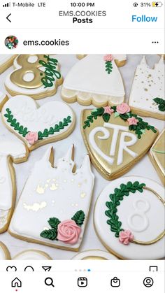 the cookies are decorated with gold and white icing