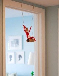 a stuffed animal hanging from the side of a window