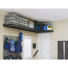 there is a shelf with many items on it in the room that has an open door