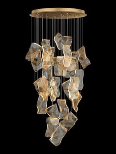 a chandelier made out of glass cubes hanging from a ceiling light fixture