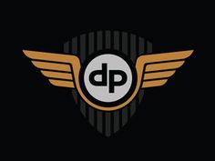 the dp logo on a black background with gold wings and a white circle in the center