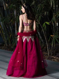 A three-piece magenta Jamina lehenga set from the Rashika Sharma collection. This gorgeous embroidered magenta lehenga set in silk organza fabric is paired with a hand-embroidered cotton silk blouse. The outfit is completed with an embroidered net dupatta. The nakshi, pechani, zardozi, sequins, mirror and resham work enhance the magenta Jamina lehenga set.
Clutch NOT included. Designer Cotton Silk Floor-length Lehenga, Designer Floor-length Cotton Silk Lehenga, Designer Resham Embroidered Cotton Silk Lehenga, Floor-length Cotton Silk Lehenga With Resham Embroidery, Wedding Lehenga In Cotton Silk With Traditional Drape, Festive Cotton Silk Lehenga With Resham Embroidery, Floor-length Cotton Silk Lehenga For Wedding, Designer Cotton Silk Lehenga With Sheer Dupatta, Cotton Silk Lehenga With Resham Embroidery For Reception