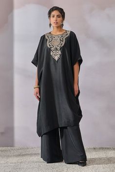 Black kaftan kurta with contrasting hand embroidered yoke with TT brooch. Comes with wide legged pant. - Aza Fashions Elegant Palazzo Set With Embroidered Neckline, Elegant Embroidered Straight Kurta Tunic, Elegant Embellished Tunic For Eid, Traditional Embroidered Evening Kurta, Elegant Black Kaftan With Chikankari Embroidery, Eid Tunic Set With Embroidered Neckline, Elegant Tunic Kaftan With Embroidered Neckline, Black Kaftan With Resham Embroidery Traditional Drape, Elegant Straight Kurta Tunic For Eid