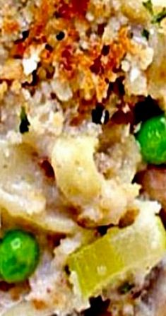 a close up view of some food with peas and other things in it on a plate