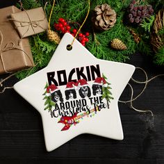 a ceramic star ornament with rockin'around the christmas tree on it