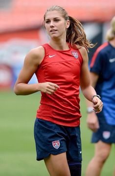 a female soccer player in action on the field