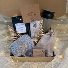 a gift box filled with coffee, tea bags and other items for someone's special occasion