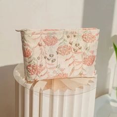 Keep your essentials organized with this charming floral makeup bag. Featuring delicate embroidered patterns, it combines style and functionality, perfect for travel or everyday use. Soft girl aesthetic Floral pattern Flower embroidered Gold embroidery detail Zip closure Cotton, polyester Size: length 26cm (10.24inch), width 5cm (2inch), height 18cm (7.1inch) Floral Makeup Bag, Floral Makeup, Embroidered Patterns, Fall Sweaters For Women, Makeup Lovers, Aesthetic Floral, Denim Hoodie, Travel Toiletry Bag, Jogger Pants Casual