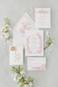 the wedding stationery was done in pink and white