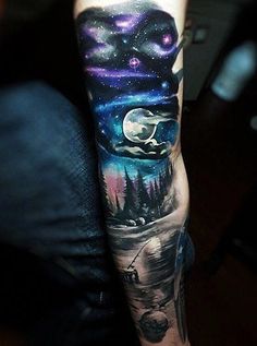 a man's arm with an image of the moon and stars in the sky