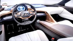 the interior of a car with leather seats and steering wheel, including an electronic display