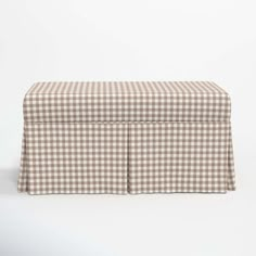 a brown and white checkered bench cover