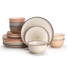 a stack of plates and bowls sitting next to each other