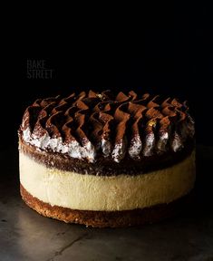 a cake that has been cut in half and is sitting on a table next to a knife