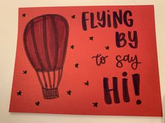 a red card with a hot air balloon on it that says flying by to say hi