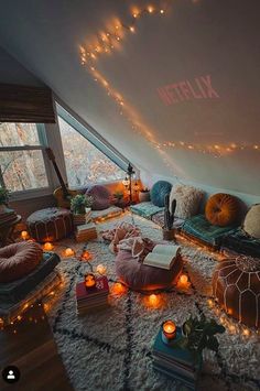 a room filled with lots of pillows and lights