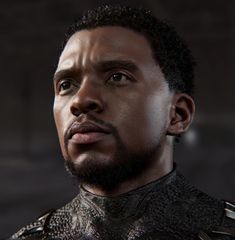 a close up of a person with a beard wearing armor and looking off to the side