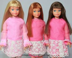 three dolls are standing next to each other