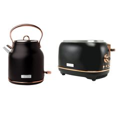 two black and gold kettles sitting next to each other