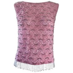 Chic 60s pink silk beaded top! So much detail to this gorgeous little gem! Lace, pearls, sequins and beads throughout. Super soft silk feels amazing against the body! Beaded fringe on the hem. Full metal zipper up the back with hook-and-eye closure. Can easily be dressed up or down. Great with jeans, shorts, trousers or a skirt. In great condition. Made in Hong Kong. Marked Size EU 38 ( Medium / Large ) Measurements: 38 inch bust Up to 36 inch waist Pink Embellished Evening Tops, Vintage Embellished Sleeveless Top, Glamorous Silk Sequined Top, Glamorous Sequined Silk Top, Glamorous Silk Top With Sequins, Glamorous Party Tops With Beaded Fringe, Glamorous Beaded Fringe Top For Party, Vintage Sleeveless Sequin Top, Glamorous Beaded Sleeveless Tops