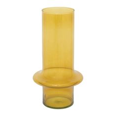 a yellow glass vase sitting on top of a white table