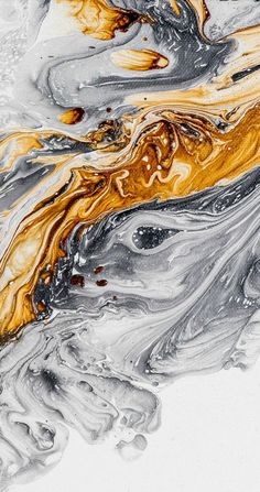 an abstract painting with gold and grey colors on it's surface, as well as water